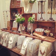 a table with many items on it and hanging from the ceiling in front of them