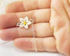 "Tiny adorable white Jasmine Anklet or Bracelet. The white flower flower is handcrafted to a 12mm size and is along a delicate cable chain in a choice of 925 sterling silver or 14k gold filled.Choose from S-M-L-XL length. -Flower Size : 12mm -Chain : Choose 925 sterling silver or 14k gold filled cable chain View matching collection at: https://www.etsy.com/shop/strandedtreasures/search?search_query=jasmine MEASURING GUIDE (using a flexible measuring tape) For a standard fit, measure where you pr Adjustable White Jewelry With Flower Decoration, White Flower Shaped Jewelry With Flower Decoration, White Flower Pendant Jewelry With Flower Decoration, Handmade White Flower Jewelry, White Flower Necklace For Gifts, Small White Dainty Jewelry, White Flower Pendant Jewelry With Floral Decoration, Delicate White Jewelry With Flower Charm, Handmade White Floral Jewelry