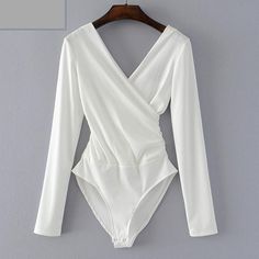 This long sleeve bodysuit featuring a plunging v-neck is the perfect item to bring you look together. Pair with jeans, leggings, skirt or shorts ... so be sure an visit our bottoms collection to find the perfect partner. Made with a polyester & cotton blend and comes in 6 fab colors. Luxury Elegant Solid Color Bodysuit, Luxury Fitted Formal Bodysuit, Luxury Elegant Fall Bodysuit, Luxury Solid Bodysuit, Luxury V-neck Bodysuit, Summer V-neck Bodysuit, Luxury Classic Fitted Bodysuit, Classic Fitted Luxury Bodysuit, Luxury Long Sleeve Bodysuit For Women