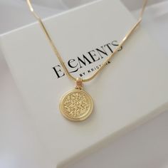 Round gold coin medallion necklace. Wear it on it's own or layer it.  Pendant details:  * Finish: non tarnish 14K gold filled  * Measurements: 0.9'H 0.7'W Chain: non tarnish gold filled Comes in our gift ready packaging: vegan leather pouch for safe jewelry storing and branded box  GOLD FILLED Tarnish Resistant. Hypoallergenic. Long Lasting. Gold filled is affordable alternative to solid gold. Hypoallergenic - sensitive skin friendly. With proper care it will last for years. What is Gold Filled? Gold Medallion Necklace With Delicate Chain For Everyday, Everyday Minimalist Coin Necklace, Everyday Gold-plated Tarnish Resistant Medallion Necklace, Everyday Gold Plated Tarnish Resistant Medallion Necklace, Everyday Gold-plated Tarnish-resistant Medallion Necklace, Everyday 14k Gold Filled Coin Necklace With Round Pendant, Minimalist Everyday Coin Necklaces, Minimalist Everyday Coin Necklace, Gold Coin Charm Necklace With Delicate Chain