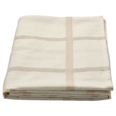 the white and beige blanket is folded on top of each other