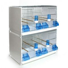 two large cages are stacked on top of each other, with blue containers in them