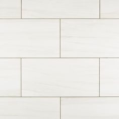 a white tile wall that is very clean and ready to be used as a background