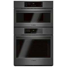 two black ovens side by side with the same door and one on each side