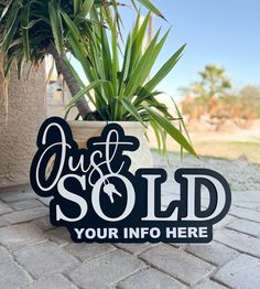 a sign that says just sold your info here in front of a potted plant