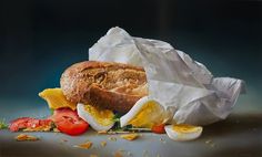 an egg, tomato and bread sandwich on white paper next to some other food items