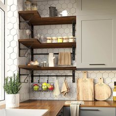 some shelves in a kitchen with wooden cutting boards