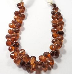 the necklace is made up of brown beads