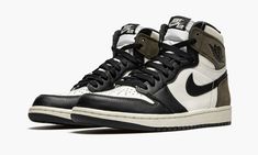 The Air Jordan 1 “Dark Mocha” progresses the timeless silhouette’s association with wearable earth tones. Inspiration for the “Dark Mocha,” a Fall 2020 release, is culled from one of the most popular sneaker collaborations of 2019—Travis Scott’s Air Jordan 1 collection. Though unlike the rapper’s take on the Jordan 1, this “Dark Mocha” iteration features smooth black leather overlays on the forefoot, eyelets, and toe cap. White leather appears on the mid-panel, collar, and perforated toe. Classi Jordan 1 Dark Mocha, Jordan 1 Mocha, Nike Essentials, Popular Sneakers, Jordan 1 High Og, Jordan Sneakers, Nike Dunk High, Air Jordan 1 Retro High Og, Air Jordan 1 Retro High