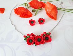 Poppy jewelry set Red poppy necklace gift Wildflower wedding Poppy gift Red poppies jewelry Red floral necklace Red flower necklace gift ♥This poppy necklace is perfect for an ethnic wedding. This necklace looks good with a wedding dress as well as a bridesmaid. A poppy necklace will be a good accessory for a theme party or other festive celebration. And if you like to be in the spotlight, then you can wear this necklace any other day. Good mood - I guarantee! Flowers poppies, made of polymer clay. For these flowers I used high quality polymer clay. Each flower is made by hand in a special technique. Flower part about 6 cm /2,36 Inches Length with chain 38.5 cm/15,16 Inches + 5 cm extension chain 5cm/ 1,96 Inches If this length is too short for you - write to me about it. I will make the l Red Flower Charm Jewelry For Valentine's Day, Red Flower Pendant Jewelry For Valentine's Day, Red Flower Pendant Necklace For Mother's Day, Red Flower Pendant Jewelry For Mother's Day, Mother's Day Red Flower Pendant Necklace, Handmade Red Jewelry Gift For Her, Handmade Red Jewelry For Mother's Day, Handmade Red Jewelry As A Gift For Her, Handmade Red Flower Jewelry