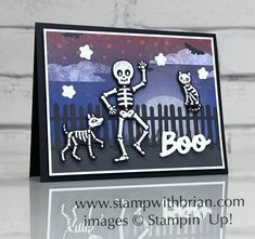 a card with a skeleton and dog on it