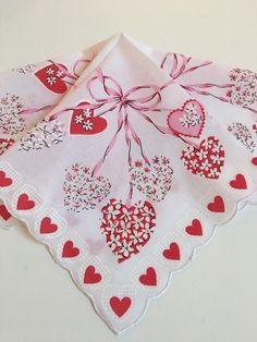 Beautiful New LuRay Valentine Hankie! Lovely Hearts & Festive Ribbon Streamers ! LuRay handkerchiefs are all cotton batiste fabric, measuring 13" square.   Our Hankies have exquisite design detail and are colorfast. All designs are from our extensive original vintage collection.   Your purchase will arrive to you in a clear cello bag.  Happy to combine shipping with multiple purchases. Ships within 2 days via USPS first class.   Thank you. Vintage Hankies Repurposed, Barbie Valentines, Batiste Fabric, Valentine Bear, Vintage Valentines Decorations, Ribbon Streamers, Vintage Valentines Day, Canyon Wedding, Crazy Quilt Stitches