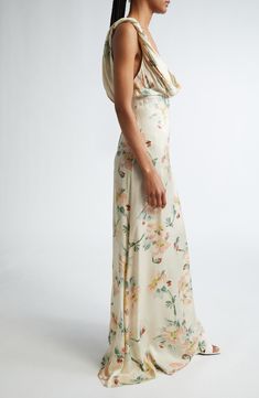 Artful construction that seemingly defies physics defines the beguilingly twisted bodice of this maxi cut from floral-print satin in a fitted-to-flowing design. 58 1/2" length (size 4US/36EU) Hidden back-zip closure Cowled deep V-neck Sleeveless Partially lined 100% viscose Dry clean Made in Portugal Designer Clothing Silk Maxi Dress With Floral Print, Spring Pre-draped Bias Cut Maxi Dress, Feminine Silk Maxi Dress With Floral Print, Floral Print Silk Maxi Dress, Satin Maxi Dress For Garden Party, Floor-length Floral Silk Maxi Dress, Satin Maxi Dress With Floral Print For Garden Party, Floral Print Satin Maxi Dress, Silk Bias Cut Dress For Garden Party