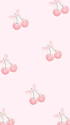 a pink wallpaper with cherries on it