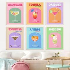 four posters with different types of drinks hanging on the wall in a living room area