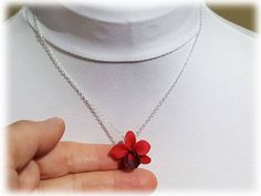 Petite hand sculpted (2.5cm) 1 inch red orchid necklace. The handcrafted orchid pendant drops from on a hand wired bail. Available on silver gold or antique brass styles. -Original hand sculpted polymer clay flowers -Durable, water-resistant -No molds, no paint, no glue -Flower size : 2.5cm Flower (about 1 inch, size of a quarter) -Chain Length : Select 16 inch or 18 inch cable chain -Style : Select Silver-plated, Gold-plated, Antique Brass, 925 sterling Silver or 14k Gold Filled View matching c Unique Orchid-colored Jewelry Gift, Unique Orchid-colored Jewelry As A Gift, Unique Orchid Colored Jewelry For Gift, Unique Orchid Jewelry For Gift, Red Flower Pendant Jewelry As A Gift For Her, Adjustable Red Jewelry With Flower Charm, Red Flower Pendant Jewelry With Flower Charm, Red Flower Pendant Jewelry With Charm, Red Flower Pendant Necklace As Gift