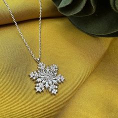 This magnificent necklace combines elegance and elegance. Handmade and carefully designed, this snowflake necklace will make you different on special occasions or in your daily life. It can be a unique gift idea. With its quality silver material and elegant design, this jewelry will make your loved ones very happy. Meaning of Snowflake Silver Necklace: It is to secretly and silently indicate that the person to whom the gift is given will be your one and only. Because every snowflake is unique, different and special. A thin silver necklace combined with a delicate chain will elegantly highlight your neck. - There are silver and gold color options. Features: - 925 sterling silver material -Chain Length: 45 cm - Snowflake: 2 cm - Handmade and special design - Since the product is entirely sil Elegant Winter Jewelry As Gift, Christmas Silver Cubic Zirconia Necklace, Silver Cubic Zirconia Necklaces For Christmas, Elegant Silver Holiday Jewelry, Elegant Snowflake Shaped Cubic Zirconia Jewelry, Formal Christmas Snowflake Jewelry, Silver Snowflake Necklace For Holiday, Sterling Silver Necklaces For Winter Gifts, Silver Necklaces For Winter Holidays