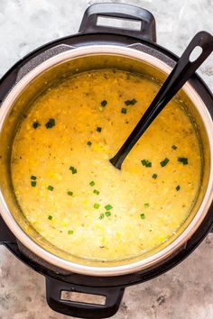 a pot filled with soup on top of a table