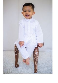 Adorable, made-to-order kurta for infants, toddlers, and kid boys! MATCHING FATHER AND SON SETS ARE AVAILABLE ON OUR SHOP Kurta ➤ Breathable and easy-to-wash cotton fabric ➤ Easy open and close clasp-buttons ➤ No-itch collar and sleeves ➤ Wide neck to easily fit over baby's head Pajama / Pant / Trouser ➤ Breathable and easy-to-wash cotton fabric ➤ White to match with several kotis, kurtas and occasions ➤ Stretchable elastic waistband Choti Koti kurtas are made without a nehru collar for our smal Boy Kurta, Kids Kurta, Boys Kurta, Classic Pajamas, White Kurta, Baby Boy Clothing Sets, Kurta Pajama, Pajama Pant, Shalwar Kameez