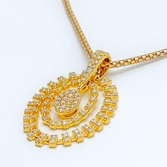 This 18k yellow gold pendant, weighing 4.6 grams, features a charming dangling oval design adorned with 0.61 carats of round brilliant cut diamonds. The diamonds, with a G-H color and VS clarity, add exceptional brilliance and elegance. Measuring 1.25 inches in length, this pendant is perfect for adding a touch of sophistication to any outfit. Please note that the chain is not included. Ideal for those who appreciate luxurious and timeless jewelry, this pendant adds a touch of refined charm to a Gold Diamond Necklace With Oval Pendant, Gold Oval Diamond Necklace Hallmarked, Yellow Gold Diamond Cut Necklace With Oval Pendant, Gold Diamond Necklace With Oval Pendant Accents, Dazzling Gold Oval Diamond Necklace, Yellow Gold Oval Diamond Necklace With Accents, Gold Diamond Necklace With Brilliant Cut Oval Pendant, Yellow Gold Diamond Necklace With Oval Pendant, Gold Oval Diamond Necklace With Accents