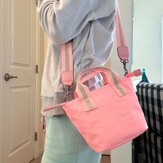 Pink Nwt Broad Body Bag Can Be Worn Several Different Ways Spring Bucket Bag With Adjustable Strap For On-the-go, Spring Trendy Canvas Bag With Adjustable Strap, Spring Crossbody Shoulder Bag With Adjustable Strap, Pink Crossbody Bucket Bag, Spring Bucket Shoulder Bag With Zipper, Spring Shoulder Bucket Bag With Zipper, Trendy Spring Crossbody Canvas Bag, Spring On-the-go Bag With Adjustable Strap, Casual Canvas Bag With Detachable Handle For Errands