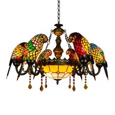 a chandelier that has birds on it