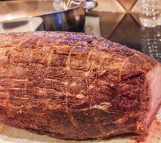 a large piece of meat sitting on top of a cutting board