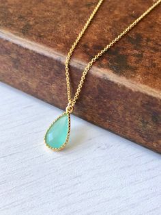 Aqua Chalcedony Necklace, Aqua Teardrop Pendant, Minimalist Gold Necklace, Turquoise Layering Necklace, Summer Necklace, Gift for women This simple dainty necklace features an ocean blue aqua chalcedony teardrop set in texturized bezel in your choice of gold filled or sterling silver. This framed stone pendant is suspended from a delicate cable chain in the finish of your choice. This necklace is simply perfect for everyday wear and is perfect for layering with other pieces in your collection. A Elegant Turquoise Teardrop Pendant Drop Necklace, Minimalist Gold Necklace, Tiny Heart Necklace, Minimalist Necklace Gold, Chalcedony Necklace, Pendant Minimalist, Rose Quartz Heart, Necklace Turquoise, Aqua Chalcedony