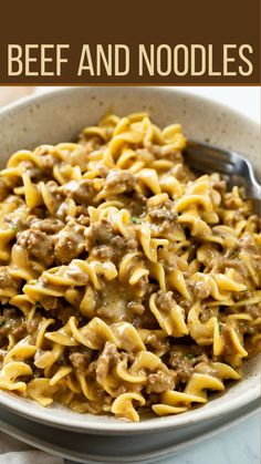 beef and noodles in a white bowl with a spoon on the side, text overlay