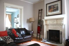 a living room filled with furniture and a fire place