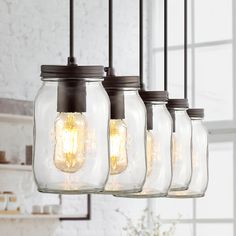 five mason jar lights hanging from a chandelier