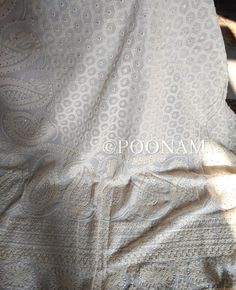 Pure georgette saree with very heavy and intricate chikankari shadow & murri embroidery, embellished with scalloped work allover. Pallu and body fully embroidered. The color of the actual product may slightly differ from the pictures. It comes with an unstitched blouse, if you want the blouse stitched please contact me, the blouse can be stitched with an additional cost. Hand embroidered items may have some loose threads. Fabric: Pure Georgette Work: Chikankari Wash: Hand Wash/Dry Clean Product color may slightly vary due to photographic lighting sources or your monitor settings. NOTE: All our items are handmade and specially customized for our beautiful customers. Please expect minor variations in the actual product as compared to the image displayed. Product color may slightly vary due t Traditional White Lehenga For Marriage, Festive White Lehenga For Marriage, Anarkali Dupatta With Intricate Embroidery For Marriage, Bollywood Style Embroidered Dupatta For Wedding, White Traditional Wear For Marriage And Festivals, White Lace Saree With Lace Work, White Georgette Dupatta With Intricate Embroidery, White Traditional Wear With Zari Work For Marriage, Traditional Embroidered Dupatta For Marriage