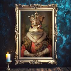 a frog wearing a crown sitting next to a lit candle in front of a blue wall