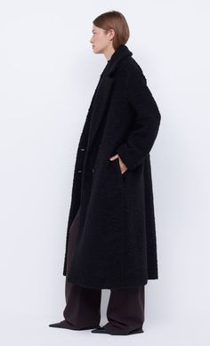 The BEC + BRIDGE Cheyenne Longline Coat is is an oversized double breasted style cut from a cozy boucle fabric. This coat includes invisible inseam pockets and is finished with 4 button closures. Bec Bridge, Longline Coat, Boucle Fabric, New Pant, Oversized Coat, Brides And Bridesmaids, New Tops, Black Coat, Guest Dresses