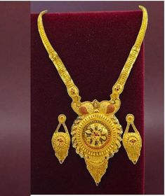 Elevate your style with this exquisite 22K gold plated traditional necklace set, perfect for special functions, weddings, or festive occasions. Designed with intricate craftsmanship, this necklace set reflects the beauty of Indian bridal jewelry. The vibrant golden hues and detailed motifs make it an ideal choice for a regal look. This set includes matching earrings to complete your ensemble, making you stand out in any celebration. The lightweight design ensures comfort without compromising ele Temple Jewelry Style Gold Plated Kundan Necklace As Gift, Gold Plated Yellow Gold Kundan Necklace For Puja, Gold Plated Kundan Necklace For Temple Jewelry Gift, Festive 22k Gold Jewelry Sets, Festive 22k Yellow Gold Jewelry Sets, Gold Plated Jewelry With Intricate Design For Puja, 22k Gold Jewelry Sets For Puja And Festive Occasions, 22k Gold Kundan Necklace For Festive Gift, Gold Jewelry With Meenakari For Puja