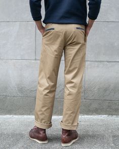 Introducing our high-quality 7.5 oz. Stretch Twill Officer Chino Trousers, a premium reproduction inspired by WWII military wear. Originating from China, these trousers were playfully dubbed "pantalones chinos" by American soldiers, adopting the Spanish term for "Chinese pants." By 1902, chinos were formally integrated into the official US Army uniform.The WWII-era service chinos prioritized mobility, boasting a high rise and wide leg for freedom of movement. In contrast, our Officer Chinos are Classic Pants With Double-needle Stitching, Khaki Chino Cotton Twill Work Pants, Classic Straight Leg Pants With Double-needle Stitching, Selvedge Cotton Bottoms For Work, Classic Fitted Bottoms With Double-needle Stitching, Selvedge Relaxed Fit Bottoms For Work, Selvedge Bottoms With Relaxed Fit For Workwear, Relaxed Fit Selvedge Bottoms For Work, Classic Selvedge Cotton Pants