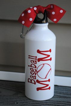 a white water bottle with a red bow on it and the words my baseball mom