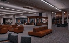 an empty library with couches and chairs in it