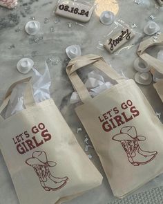 three bags that say let's go girls with cowboy boots and confetti