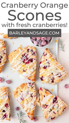 cranberry orange scones with fresh cranberries on a white platter