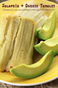 an image of some food on a plate with avocado and cheese tamales