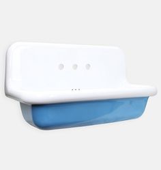 a white and blue sink mounted on the wall