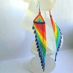 a white mannequin with multicolored earrings on it