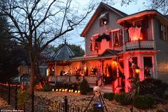 a house decorated for halloween with lights and decorations