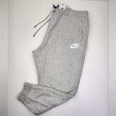 Brand New With Tags Nike Standard Fit Sportswear Fleece Sweatpants Women's Size 3x Details: Just Do It Waistband Heather Gray Colorway Elastic Waist Drawstring Waist High Rise Two (2) Pockets Cuffed Ankles Measurements: Waist Circumference 45" Inseam 27" Rise 15" Questions?? Please Feel Free To Send A Message. Thank You For Checking Out Our Listing. Smoke/Pet Free. Nike Fleece Pants For Loungewear, Nike Fleece Sweats For Leisure, Gray Sportswear Sweatpants For Loungewear, Nike Fleece Bottoms For Loungewear, Nike Cotton Athleisure Tracksuit, Nike Casual Long Sleeve Tracksuit, Gray Sportswear Sweats For Loungewear, Nike Comfortable Joggers For Loungewear, Fleece Sportswear Pants For Loungewear