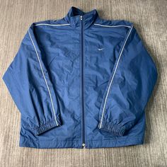 Vintage 2000s Nike Swoosh Check Sportswear Athletic Y2K Aesthetic Streetwear Blue Zip Up Jacket Extra Large Mens Condition: Fair Used Condition = Staining Throughout The Jacket Due To Age And Wear  Measurements: Please see photos above for all measurements IF YOU BUY TWO OR MORE ITEMS USE THE CODE BUNDLE @ CHECK TO SAVE 20% WE SHIP WITHIN 24 HOURS AFTER PURCHASE! Please be aware that we do not offer free returns!! The Buyer is responsible for the cost of the return label.  Follow us on TikTok & Cheap Men's Blue Track Jacket, Blue Athleisure Outerwear For Streetwear, Blue Sportswear Windbreaker With Pockets, 90s Style Long Sleeve Outerwear For Sports Events, Blue Sportswear Windbreaker For Streetwear, Blue Sportswear Track Jacket For Gym, Blue Sportswear Windbreaker For Gym, Blue Sports Windbreaker, Navy Sportswear Windbreaker For Sports