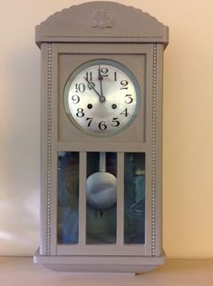 a clock that is on top of a shelf