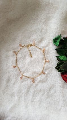 "This bracelet is made with natural Sunstone beads (4 mm), gold plated chain and gold plated clasp.  The length of the extension is approximately 1inch (excluding the bracelet length). The number of the beads which wrapped in the chain is 9 beads.  Measure with a non-stretchy string or flex tape above your ankle bone and add 1/2\". For example; if your ankle measures 8\", you will need a 8¼ - 8¾\" anklet. This will allow room to loosen or tighten the beaded anklet to fit just right. Please note: store your jewellery individually to keep them from scratching each other. Avoid contact with perfume, body lotions, hairspray or any other chemical. Also available in real platinum plated. Please contact me in case you have any questions." Gold Crystal Bracelet With Adjustable Chain, Dainty Style, Gold Dainty Crystal Bracelet With Adjustable Chain, Dainty Gold Crystal Bracelet With Adjustable Chain, Handmade Dainty Gold Crystal Bracelet, Gold Crystal Bracelet With Beaded Chain For Gift, Adjustable Gold Charm Bracelet With Beaded Chain, Gold Beaded Dangle Charm Bracelet, Elegant Gold Crystal Bracelet With Beaded Chain, Elegant Gold Anklets With Round Beads