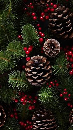 pine cones and red berries are on the tree