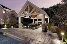 an outdoor dining area next to a swimming pool at night with lights on the patio